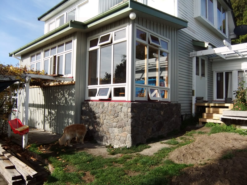 Living room North West corner and low windows to catch warm air from rock walls